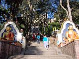 Kathmandu Swayambhunath 11 Buddha Statues Flank Steps Half Way To The Temple 